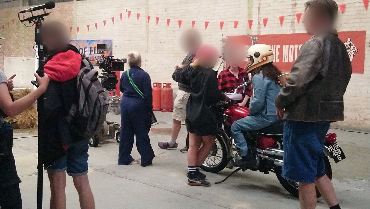 Triumph motorcycle on a film set with crew